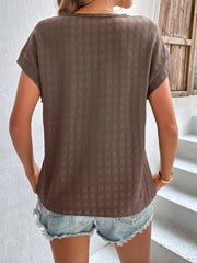 Woven texture cap-sleeve top in tan with a relaxed fit.