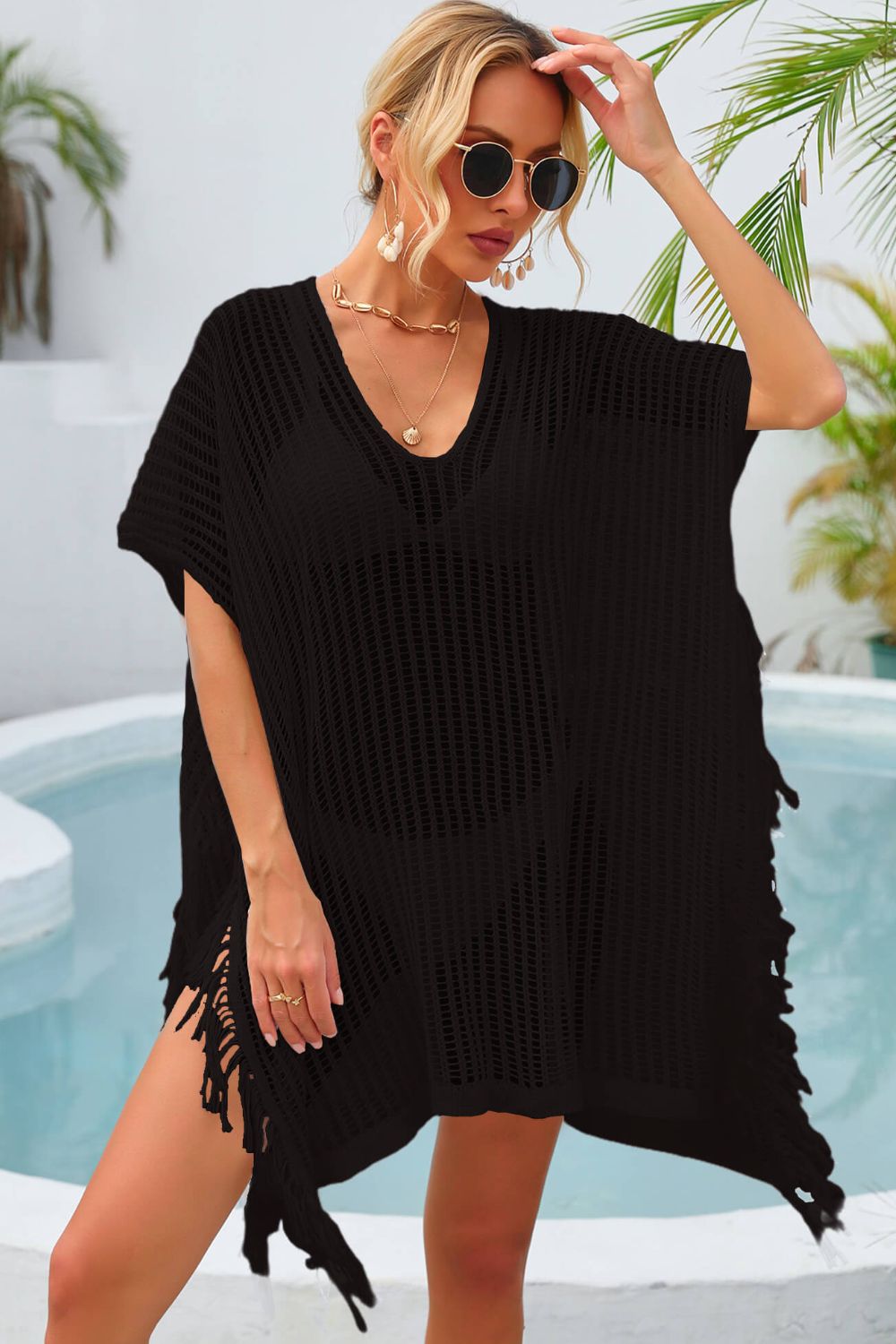 Black open-knit beach cover-up with V-neck and fringe hem.