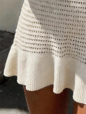 Openwork knit sweater dress in white with a frill hem detail.