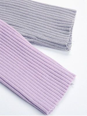 Colorblock ribbed cropped cardigan in lavender and grey, showing fabric detail.