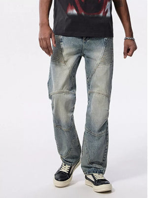 Men's light wash wide-leg jeans with moto-inspired paneling and ribbed knee details.
