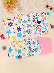 Baby shorts and tops with butterfly, flower, and heart prints.