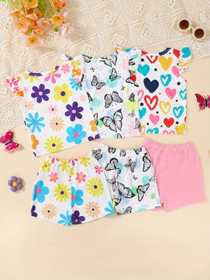 Baby shorts and tops with butterfly, flower, and heart prints.