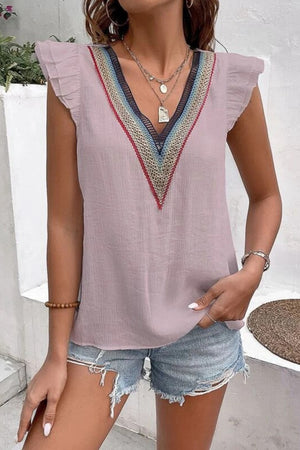 Dusty pink flutter sleeve blouse with colorful embroidered V-neck trim.