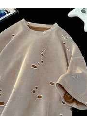 Oversized taupe cotton t-shirt with distressed holes and raw edges.