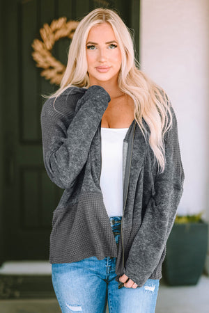 Colorblock knit zip-up hoodie in charcoal with waffle texture panels and a relaxed fit.