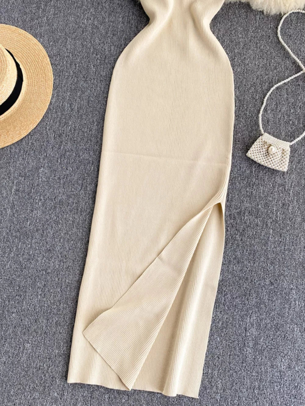 Ribbed knit midi dress with high slit and cutout back detail.