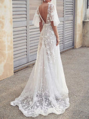 White lace flutter sleeve v-neck dress with floral embroidery and train.