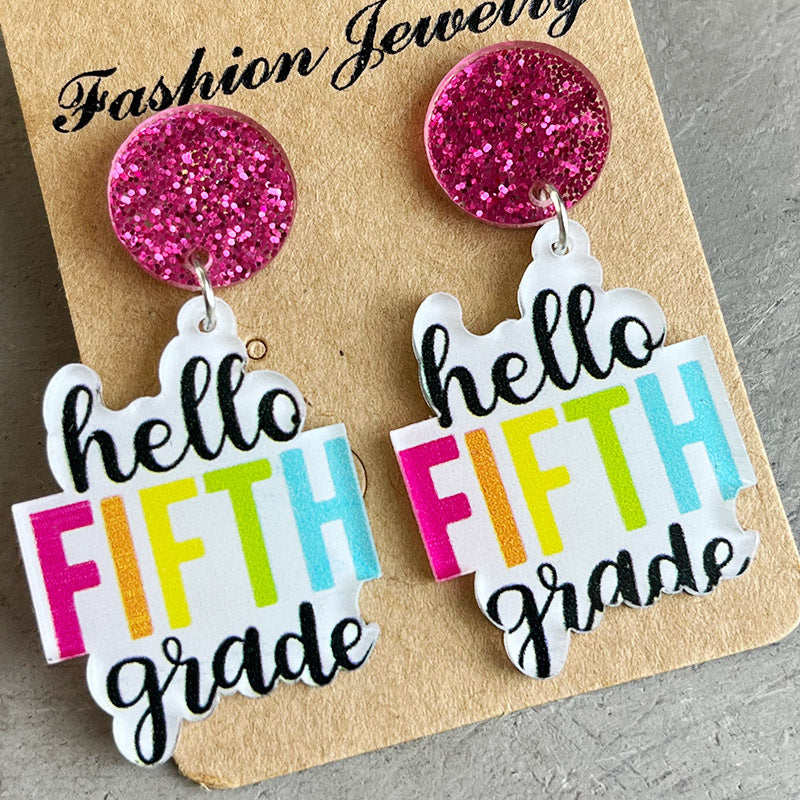 Acrylic drop earrings with pink glitter tops and "hello FIFTH grade" text in bright colors.