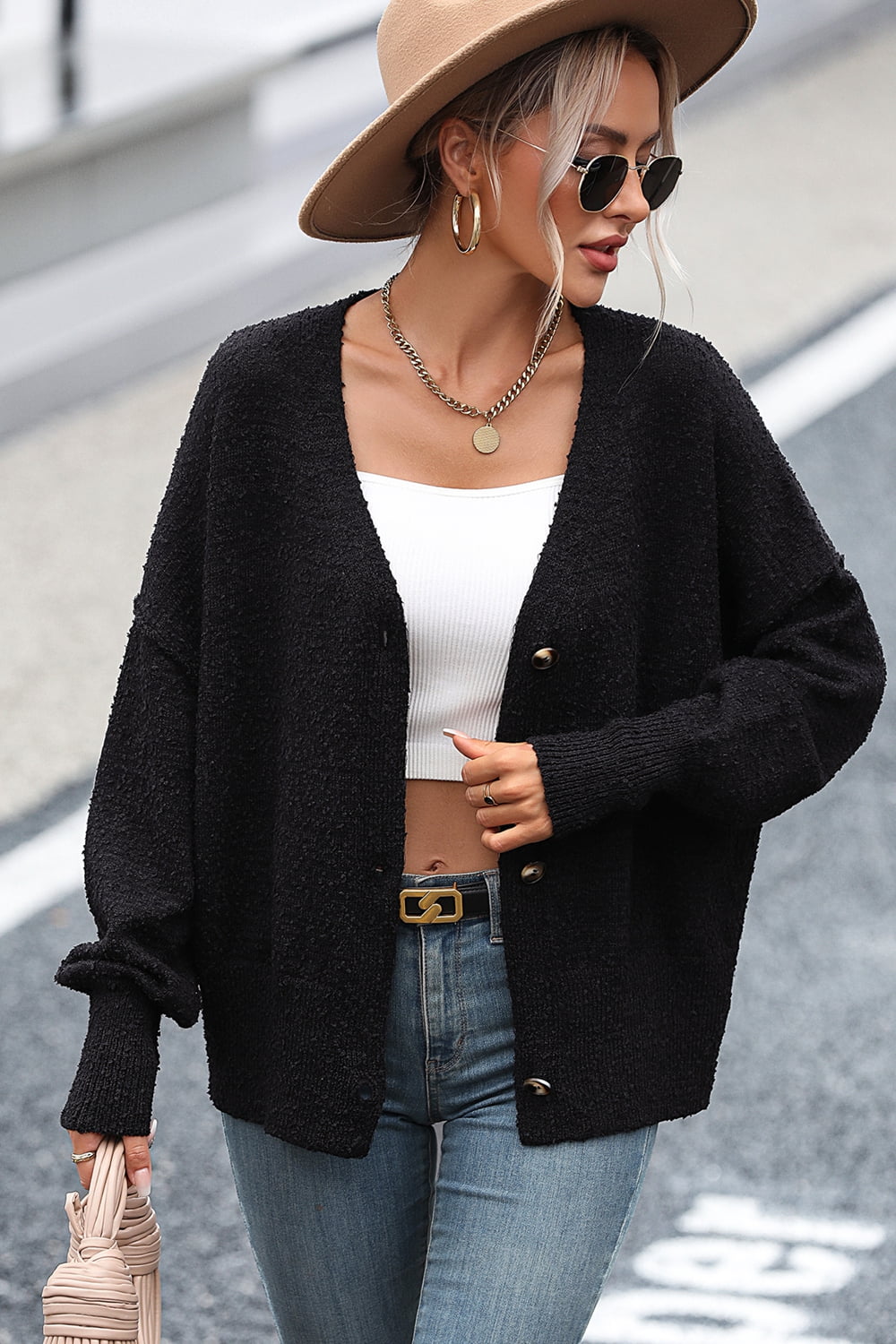 Black textured bouclé button-down cardigan with gold buttons, relaxed fit, and v-neck.