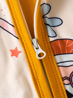 Baby one-piece with playful holiday print and yellow zipper detail.