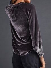 Velvet gathered yoke blouse in dusty blue with buttoned cuffs.
