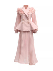 Pink skirt suit with frill collar, balloon sleeves, peplum jacket, and pleated maxi skirt.