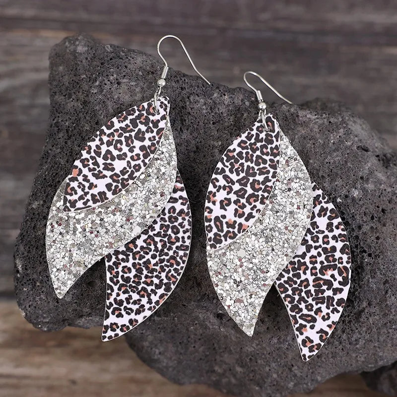 Leopard print layered drop earrings with silver glitter accents, gold tone hooks