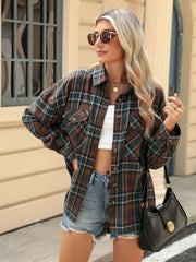 Plaid collared long sleeve shirt with button-down front and chest pockets.