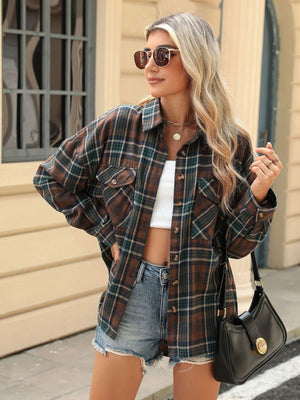 Plaid collared long sleeve shirt with button-down front and chest pockets.