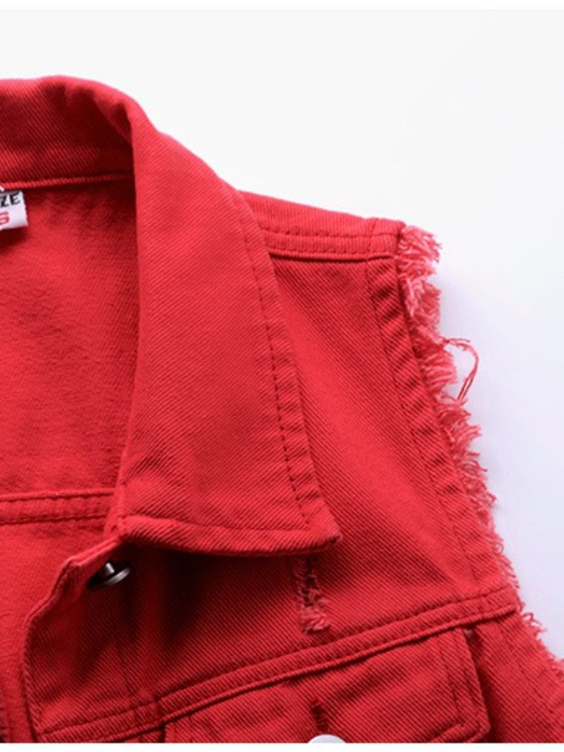 Red denim vest with frayed shoulders and collar detail