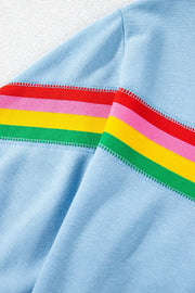 Light blue activewear shorts with rainbow stripe detail