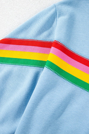 Light blue activewear shorts with rainbow stripe detail