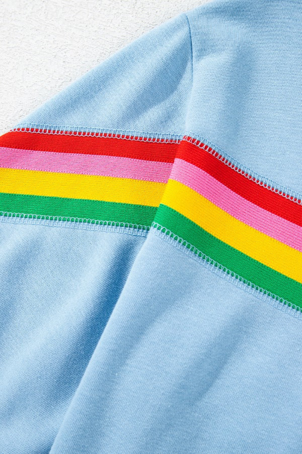 Light blue activewear shorts with rainbow stripe detail