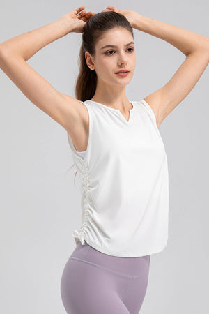 White active tank top with notched neckline and side ruching detail.