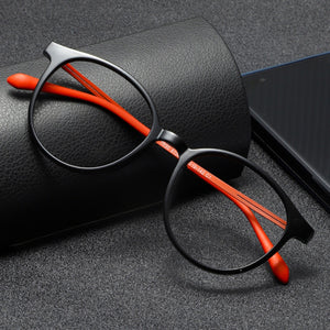 Black acetate round frame glasses with orange temples