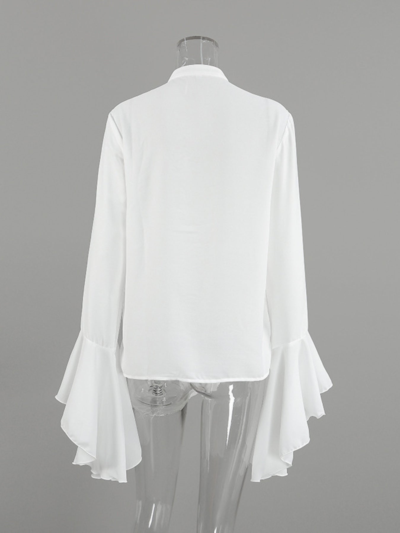 White ruffled flounce sleeve blouse with buttoned front detail.