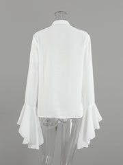 White ruffled flounce sleeve blouse with buttoned front detail.