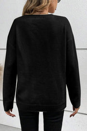 Black crewneck sweater with appliqué detail, long sleeves, and ribbed hem.