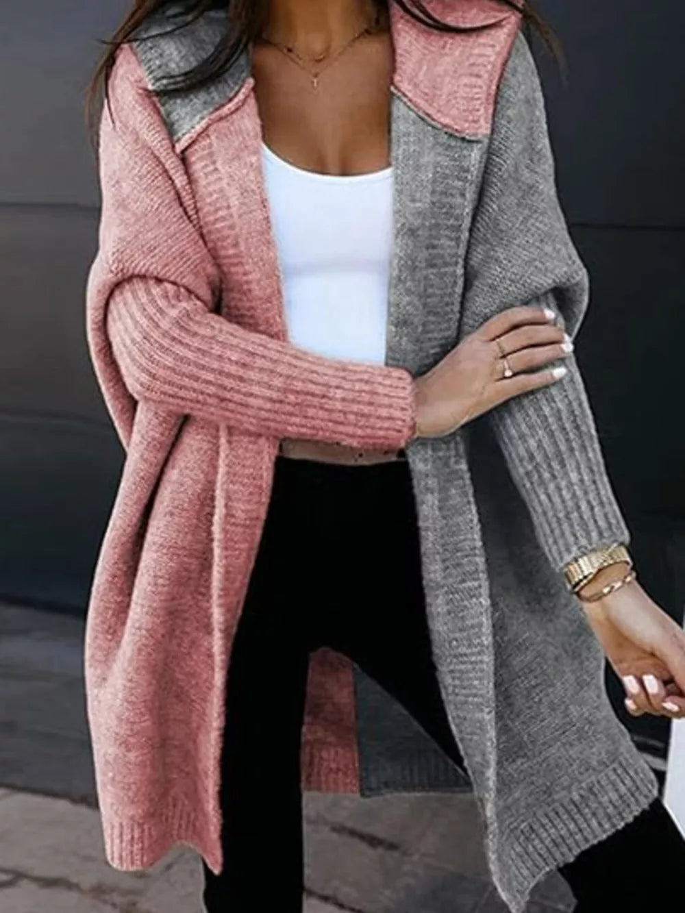Two-tone hooded knit cardigan in dusty pink and gray acrylic with ribbed sleeves.