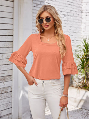 Peach ruffled sleeve square neck blouse with a casual fit.
