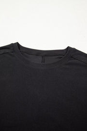 Black maternity t-shirt with crew neck and lace detail.