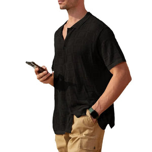 Black open-knit resort shirt with geometric texture, short sleeves, and button-down front.