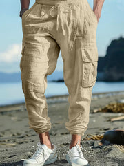 Khaki cargo pants with drawstring waist and elastic cuffs, featuring side pockets.