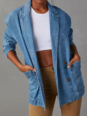 Denim blazer in dusty blue with structured shoulders and buttoned front, styled with a white crop top.