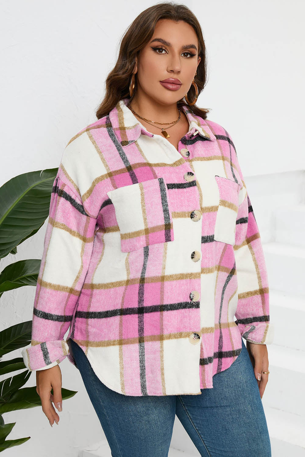 Oversized pink plaid shacket with button front and two patch pockets.