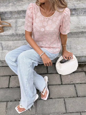 Pink embroidered floral blouse with pearl trim and puff sleeves.