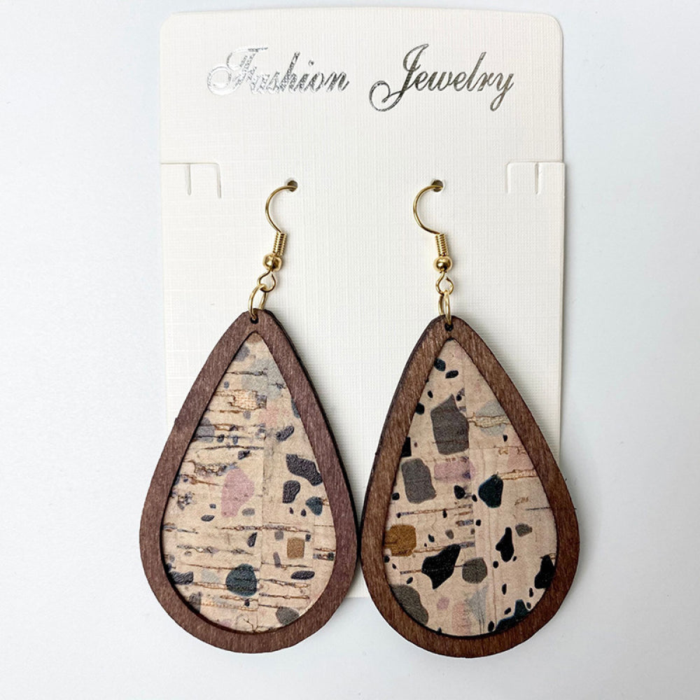 Cork teardrop earrings with botanical print and wood trim.