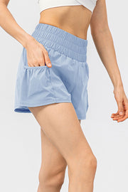 Light blue active shorts with gathered waistline and pockets