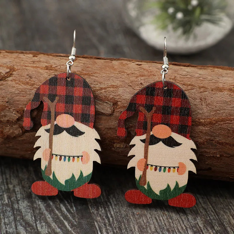 Plaid gnome dangle earrings in deep red with festive lights detail.