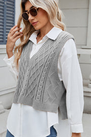 Gray cable knit diamond pattern sweater vest with V-neck.
