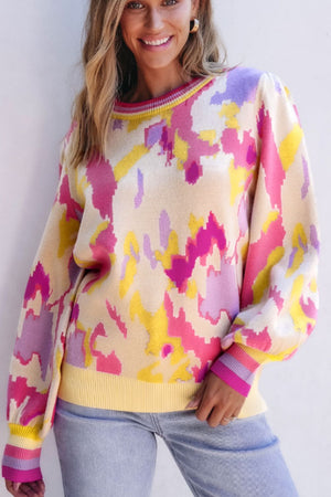 Abstract brushstroke knit sweater with puff sleeves and crewneck in floral colors.