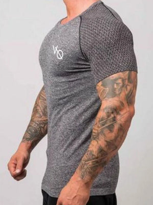 Gray performance raglan tee with textured sleeves and white logo