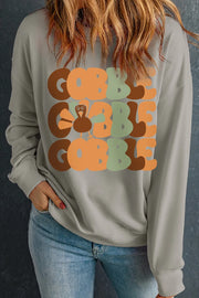 Gray crewneck sweatshirt with stacked "Gobble" text and a turkey graphic.