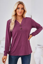 Burgundy Henley neckline jersey top with button detail and long sleeves.
