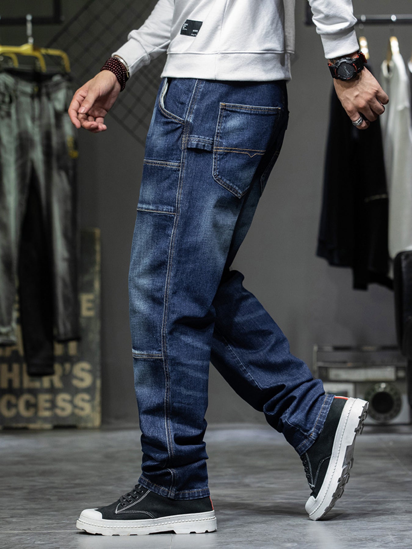 Men's dark blue 100% cotton cargo jeans with relaxed fit and visible pocket details.