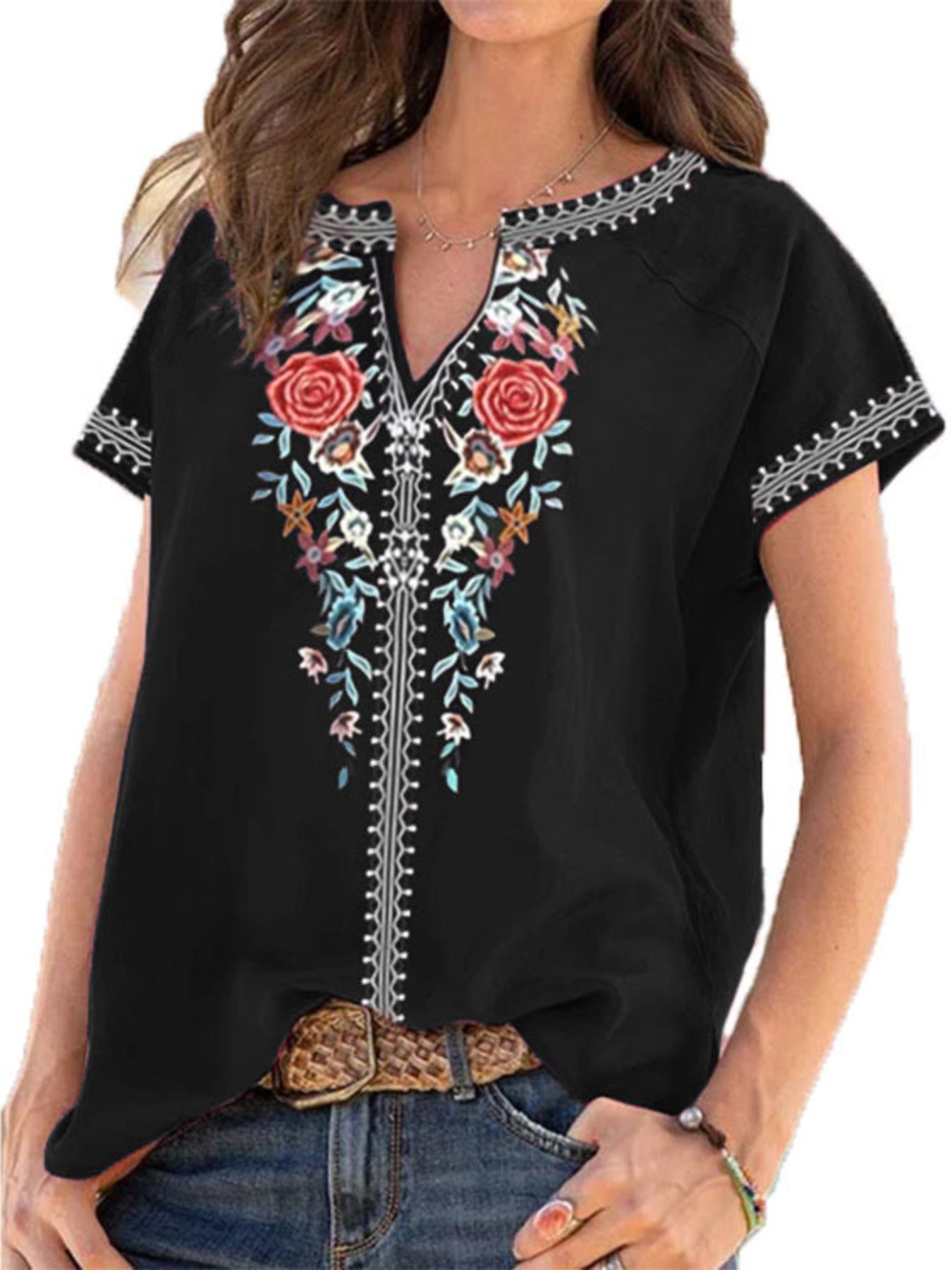 Black blouse with floral embroidery and notched neckline.