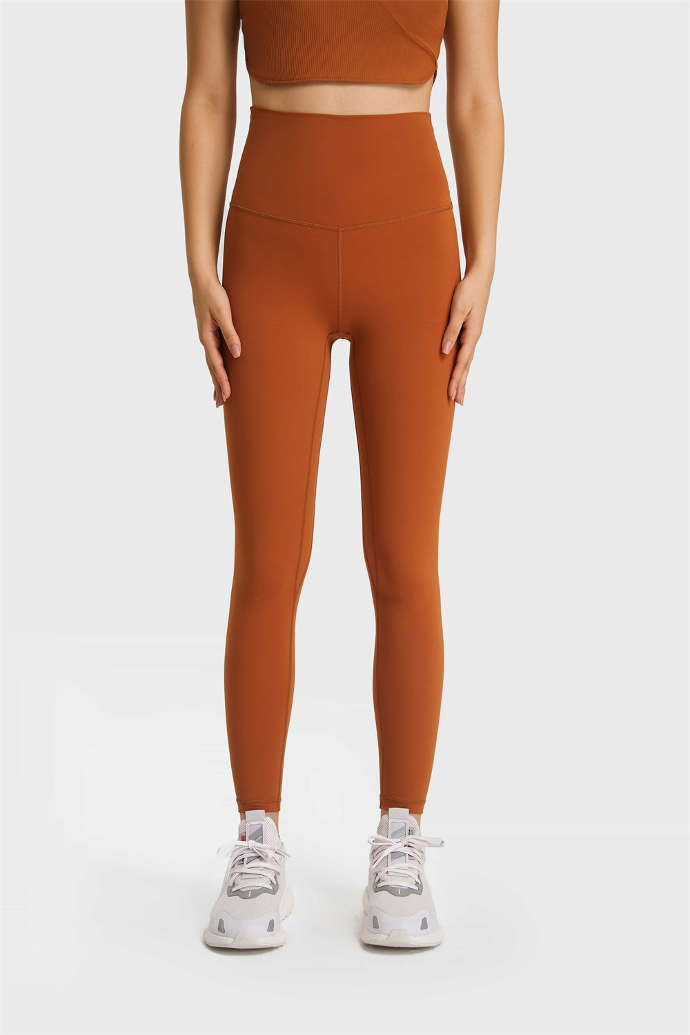 SoftLux high rise leggings in a warm brown color with a seamless waistband.