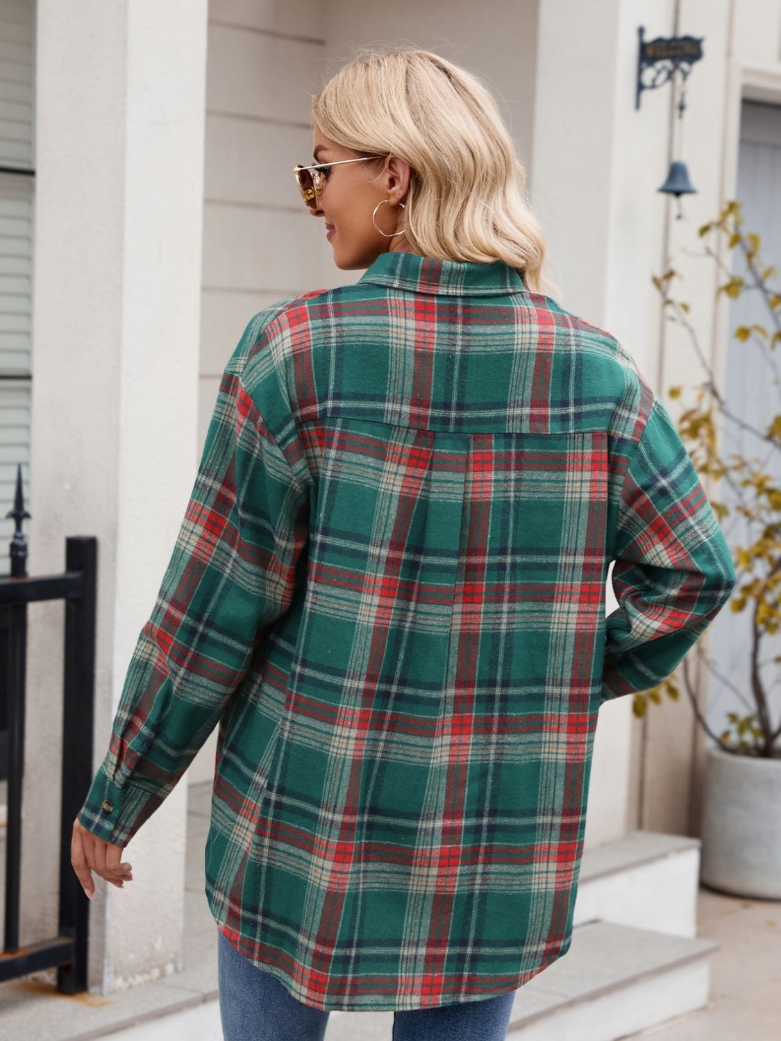 Green plaid overshirt with buttoned cuffs and collar, shown from the back.