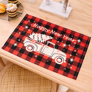 Festive plaid placemat with white truck and trees, says Happy New Year